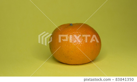 Tangerines on a yellow background, citrus subject photography Tangerines on a yellow background, citrus subject photography 83841350