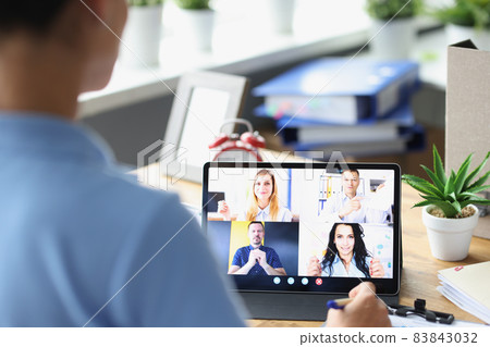 Woman talking conference call using digital tablet closeup Woman talking conference call using digital tablet closeup 83843032
