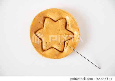 Brown sugar caramel candy cookies with a metal needle Brown sugar caramel candy cookies with a metal needle 83843125