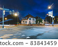 Cross-road in the evening city 83843459