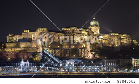 Buda Castle, Royal Palace by the Danube river illuminated at night in Budapest, Hungary Buda Castle, Royal Palace by the Danube river illuminated at night in Budapest, Hungary 83843592