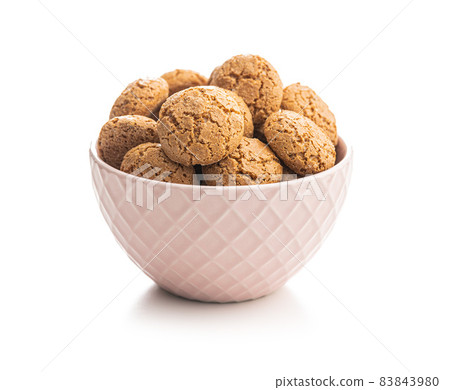 Amaretti biscuits in bowl. Sweet italian almond cookies. Amaretti biscuits in bowl. Sweet italian almond cookies. 83843980