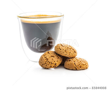 Amaretti biscuits. Sweet italian almond cookies and coffee cup Amaretti biscuits. Sweet italian almond cookies and coffee cup 83844008