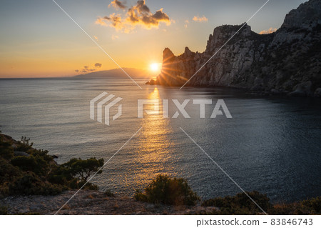 The evening sunset over the Caraul-Oba mountain, Novy Svet, Crimea The evening sunset over the Caraul-Oba mountain, Novy Svet, Crimea 83846743