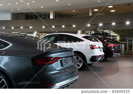 dealership car show of premium cars, cars in a row, rear view 83849535