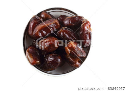 Date fruits on saucer isolated on white Date fruits on saucer isolated on white 83849957
