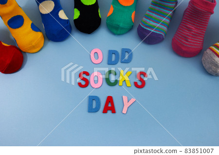 Odd Socks Day. Day lost socks, lonely socks on blue background. 83851007