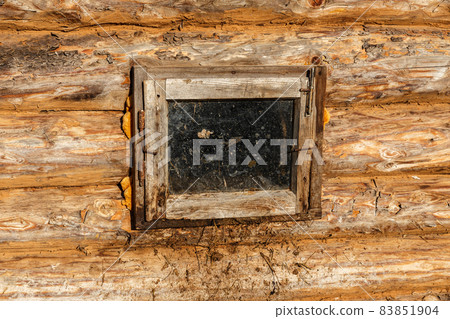 window in a log wall window in a log wall 83851904