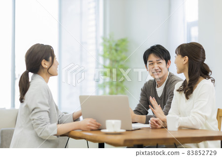 A couple and a business woman having a business talk A couple and a business woman having a business talk 83852729