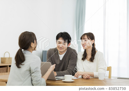 A couple and a business woman having a business talk 83852730