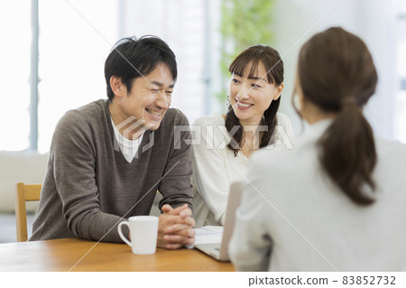 A couple and a business woman having a business talk A couple and a business woman having a business talk 83852732