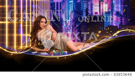 Woman in golden dress. Holding some cash, posing lying on green playing table with stacks of chips, cards on it. Cityscape background. Poker, casino Woman in golden dress. Holding some cash, posing lying on green playing table with stacks of chips, cards on it. Cityscape background. Poker, casino 83853648