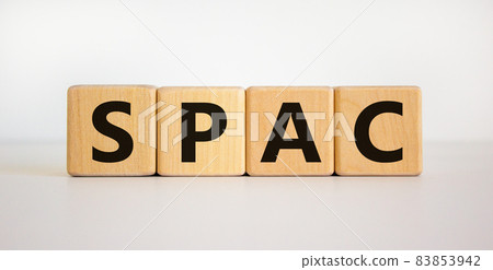 SPAC, special purpose acquisition company symbol. Wooden cubes with word 'SPAC' on beautiful white background, copy space. Business and SPAC, special purpose acquisition company concept. 83853942