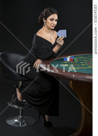 sexy woman with poker cards and chips sexy woman with poker cards and chips 83854585