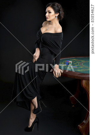 sexy woman with poker cards and chips 83854627