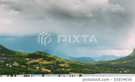 More og Romsdal county, Norway. Village On Coast Of Beautiful Lake In Summer Cloudy Day. Norwegian Nature. 4K More og Romsdal county, Norway. Village On Coast Of Beautiful Lake In Summer Cloudy Day. Norwegian Nature. 4K 83854656