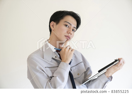 Blue collar man with binder Blue collar man with binder 83855225