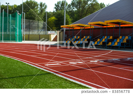 Red treadmill at the stadium with the numbering Red treadmill at the stadium with the numbering 83856778