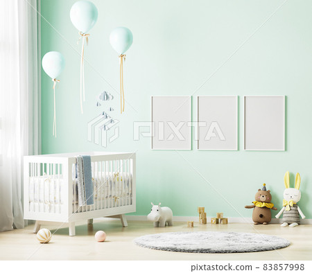 Blank poster frames mock up on green wall in nursery room interior background with baby bedding, soft toys, balloons, 3d rendering 83857998
