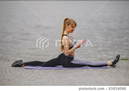 Sports girl training in a summer park Sports girl training in a summer park 83858098