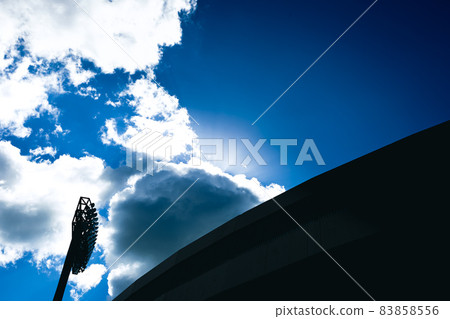 Baseball field, blue sky and lighting 83858556
