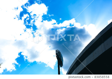 Baseball field, blue sky and lighting 83858558