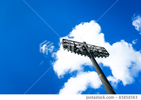 Baseball field, blue sky and lighting 83858563