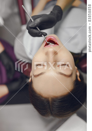 Beautiful girl sitting in the dentist's office Beautiful girl sitting in the dentist's office 83858858