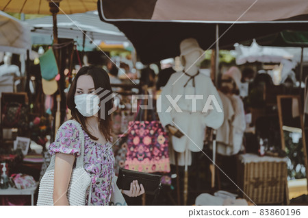 Series photo of young woman travel and shopping in street market , Chiang mai north of thailand Series photo of young woman travel and shopping in street market , Chiang mai north of thailand 83860196