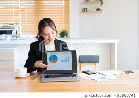 Sales woman presenting on a computer Sales woman presenting on a computer 83860741