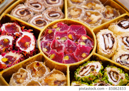 Traditional tea with lokum and muska, Turkish delight. Traditional tea with lokum and muska, Turkish delight. 83862833