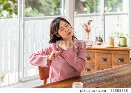 A sick woman wearing a loungewear in a bright room 83865588