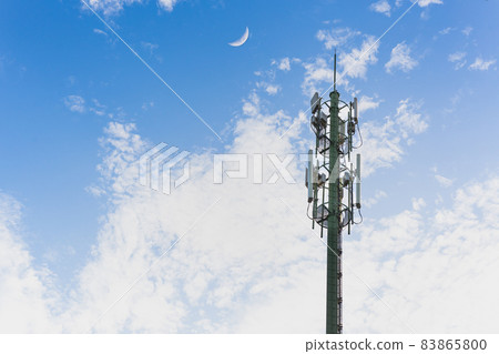 Telecommunication tower with blue sky and white clouds background. Telecommunication tower with blue sky and white clouds background. 83865800