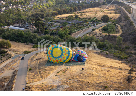 Aerial view of colorful hot air balloons preparation for launch over San Diego 83866967