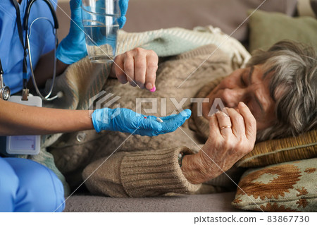 A young nurse is caring for an elderly 80 year-old woman A young nurse is caring for an elderly 80 year-old woman 83867730