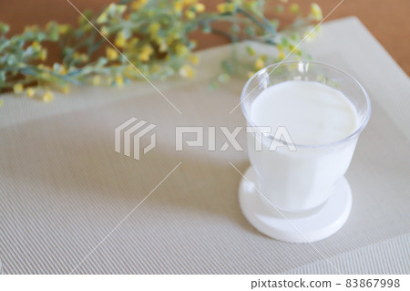 Milk in a glass 83867998
