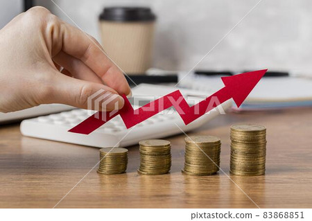 hand holding growth arrow with coins. High quality beautiful photo concept 83868851