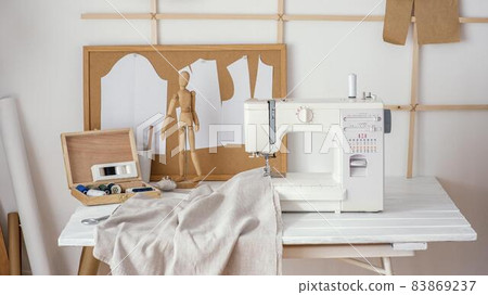 front view tailoring studio with sewing machine. High quality beautiful photo concept 83869237
