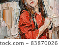 .Girl in the rain with an umbrella in her hands. 83870026