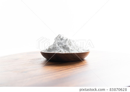 flour in a wooden bowl flour in a wooden bowl 83870628