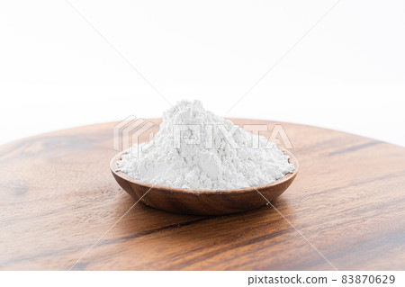 flour in a wooden bowl flour in a wooden bowl 83870629