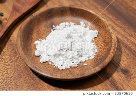 flour in a wooden bowl flour in a wooden bowl 83870656