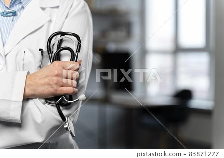 front view female doctor holding stethoscope with copy space. High quality beautiful photo concept 83871277