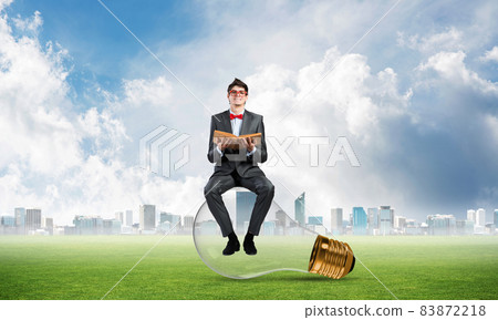 young businessman with a book young businessman with a book 83872218