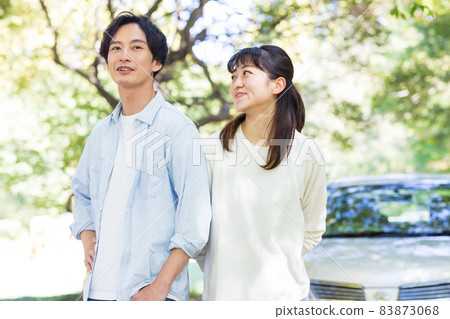 Men and women enjoying a drive date Men and women enjoying a drive date 83873068