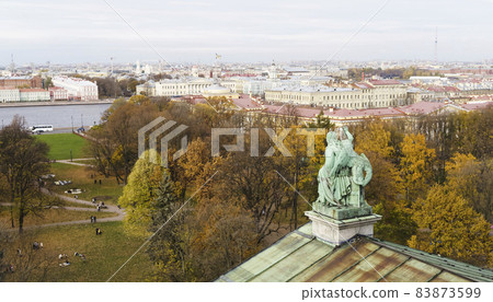 Panorama of St. Petersburg from the background height. View of the rooftops of St. Petersburg in autumn. Points of interest and city center Panorama of St. Petersburg from the background height. View of the rooftops of St. Petersburg in autumn. Points of interest and city center 83873599