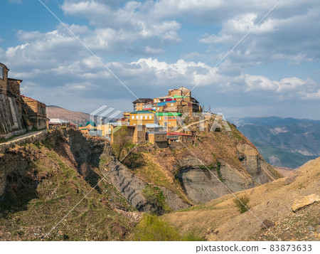 Old village on the top of mountain in Dagestan. Authentic Dagestani mountain village of Choh. Rural clay and stone houses. Russia. Old village on the top of mountain in Dagestan. Authentic Dagestani mountain village of Choh. Rural clay and stone houses. Russia. 83873633
