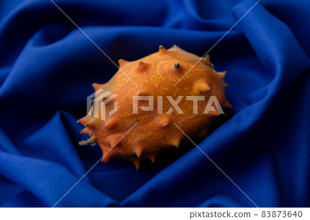 Kiwano spooky fruit image photo blue background Kiwano spooky fruit image photo blue background 83873640