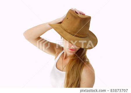 Young lady in cowboy hat Young lady in cowboy hat 83873707