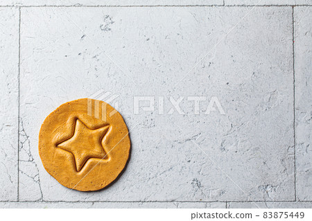 Dalgona Candy - South Korean treat. Round sugar cookie with star inside. Dalgona Candy - South Korean treat. Round sugar cookie with star inside. 83875449